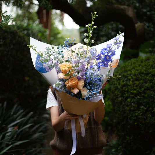 in blue hue, delphinium, hydrangea, baby breath, rose