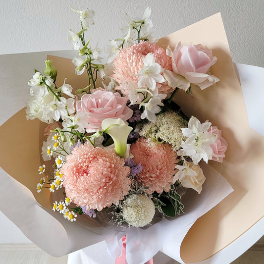pink flowers with roses, stock, chrysanthemum, lisianthus, delphinium, chamomile