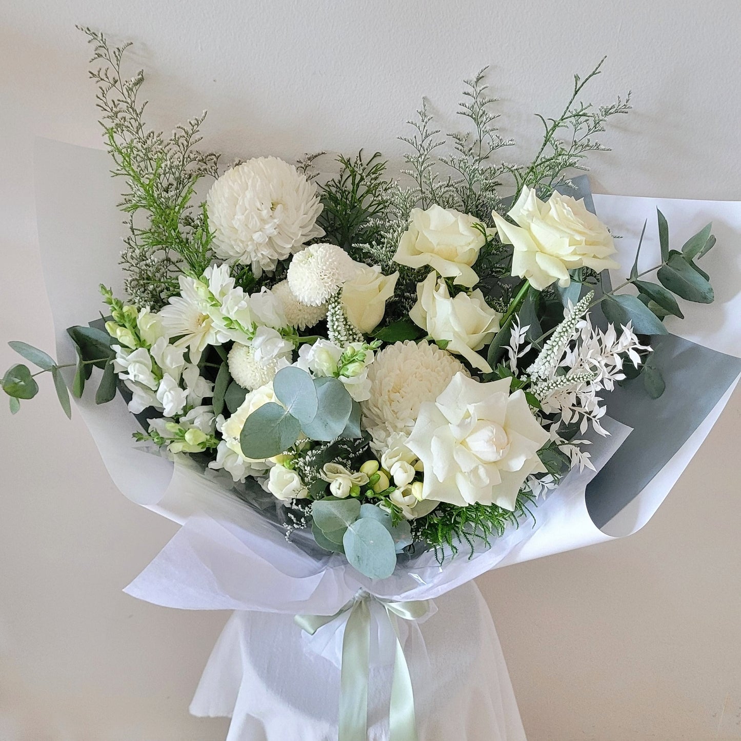 Classic white wrapped with roses, chrysanthemum, stock, pompon chrysanthemum
