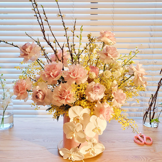 modern flower box with roses, orchid, seasonal flowers