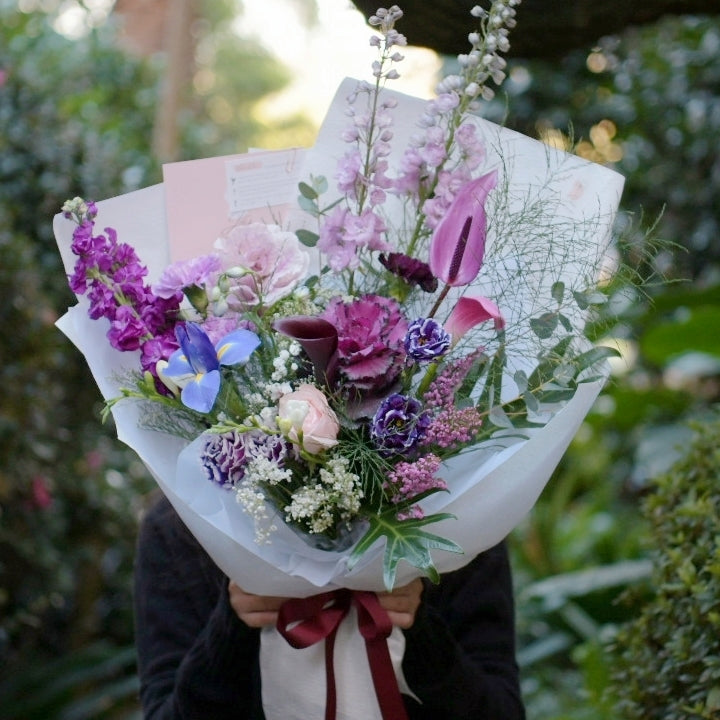 purple blooms, iris, stock, lisianthus, kale, delphinium, calla lily